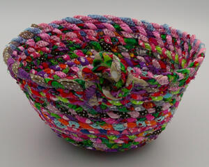 This view shows both the inside and outside of the basket with its big knot for embellishment. 